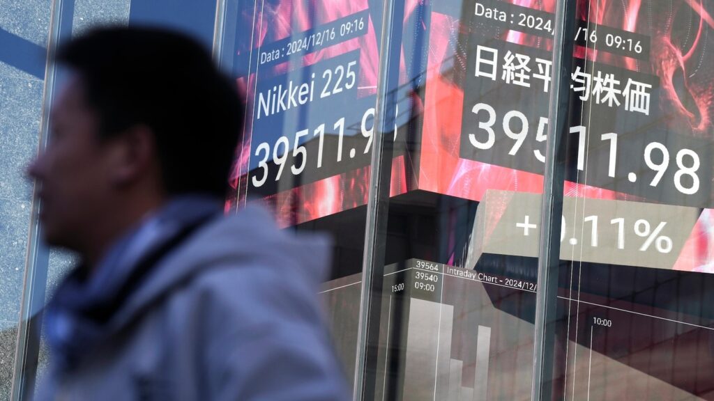 Stock market today: Asian shares are mixed after Nasdaq sets a record ahead of Fed meeting